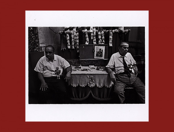 2 Men sitting in front san Gennaro